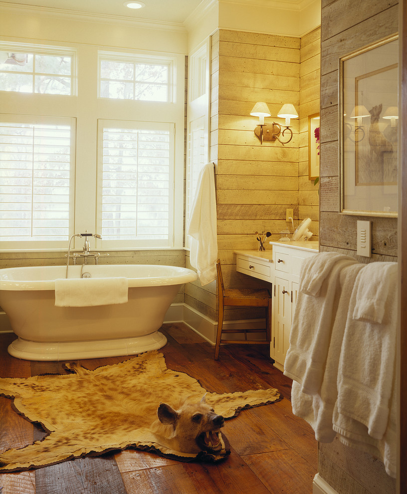Mid-sized farmhouse master dark wood floor freestanding bathtub photo in Atlanta with an undermount sink, white cabinets and marble countertops