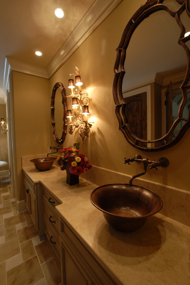 Inspiration for a transitional beige tile bathroom remodel in Charlotte with a pedestal sink, furniture-like cabinets, distressed cabinets, marble countertops and beige walls