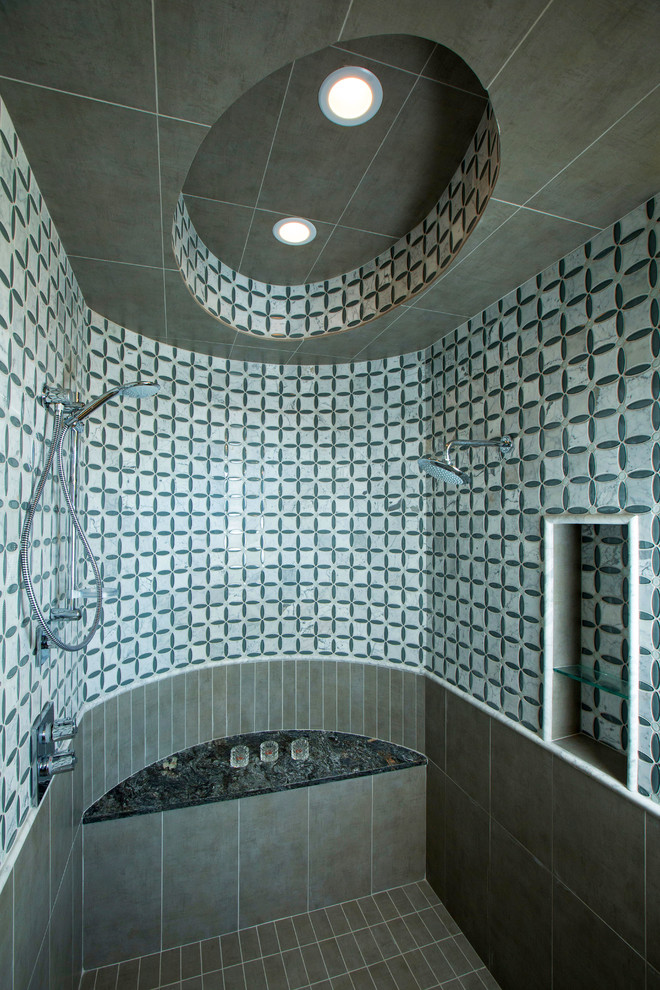 This is an example of a contemporary bathroom in Minneapolis with a double shower and multi-coloured tiles.