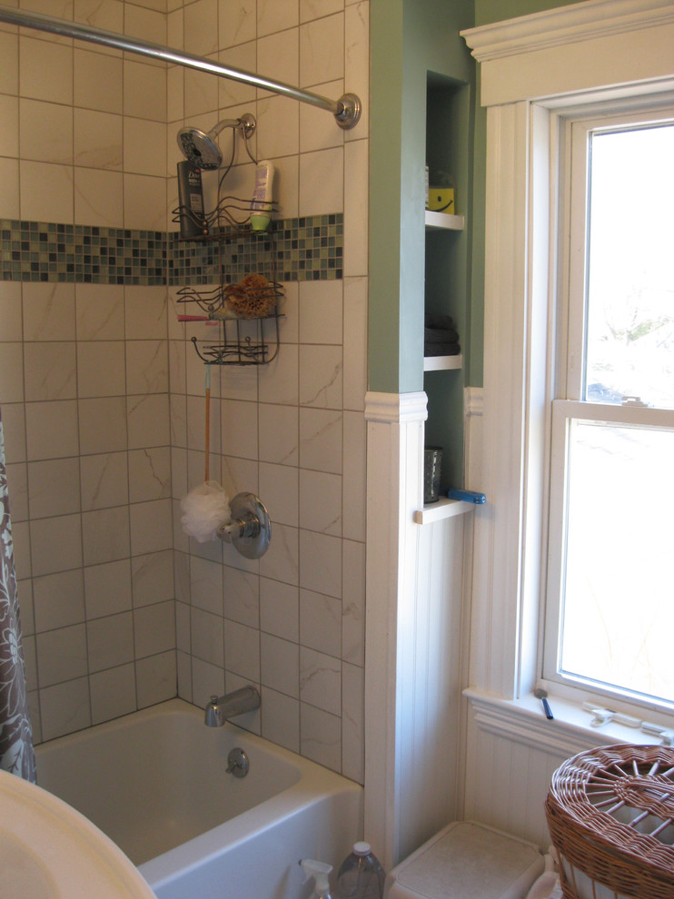 This is an example of a small eclectic family bathroom in Boston with multi-coloured tiles, an alcove bath, a shower/bath combination, a two-piece toilet, a pedestal sink, green walls and porcelain flooring.