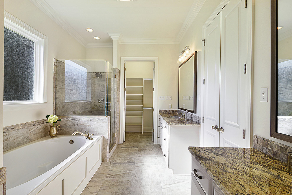 Inspiration for a large traditional ensuite bathroom in New Orleans with raised-panel cabinets, beige cabinets, an alcove bath, a corner shower, beige walls, ceramic flooring, a submerged sink, granite worktops, brown floors and a hinged door.