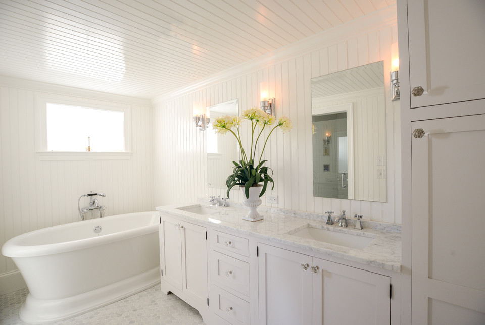 Bathroom - large coastal master white tile and stone tile marble floor bathroom idea in Philadelphia with an undermount sink, shaker cabinets, white cabinets, marble countertops and white walls