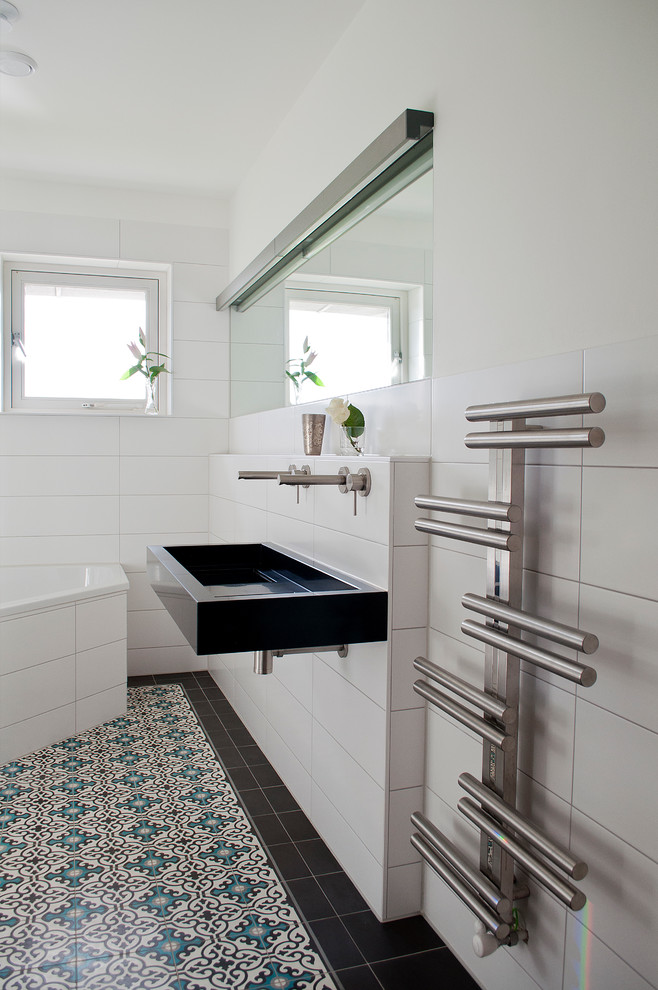 Example of a small trendy bathroom design in Amsterdam with a trough sink and white walls