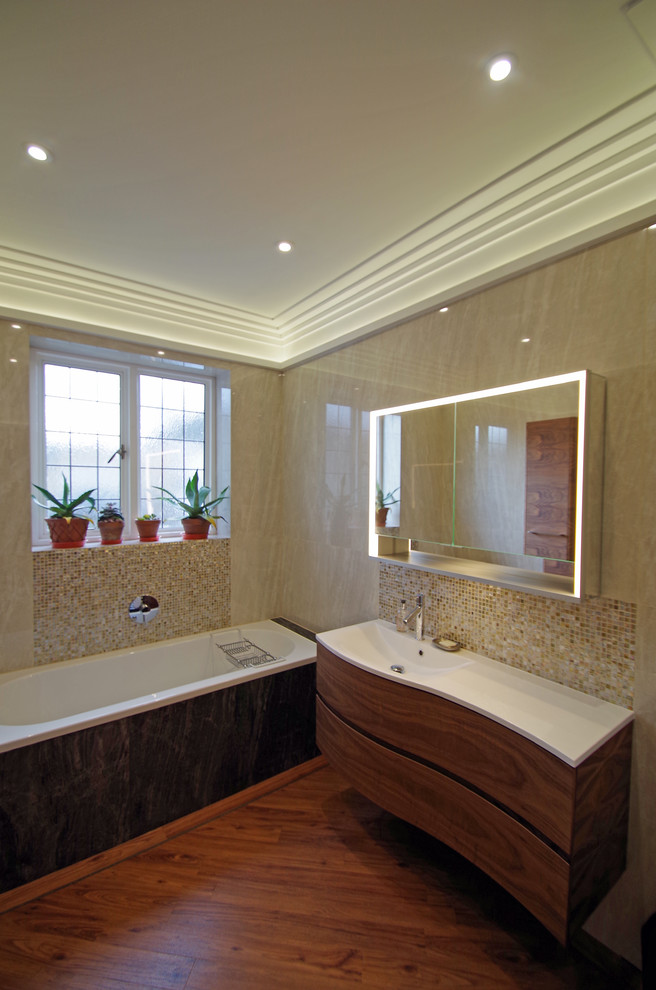 Inspiration for a small classic family bathroom in Surrey with flat-panel cabinets, dark wood cabinets, a built-in bath, a walk-in shower, a two-piece toilet, ceramic tiles, grey walls, vinyl flooring, a console sink, solid surface worktops, brown floors and an open shower.