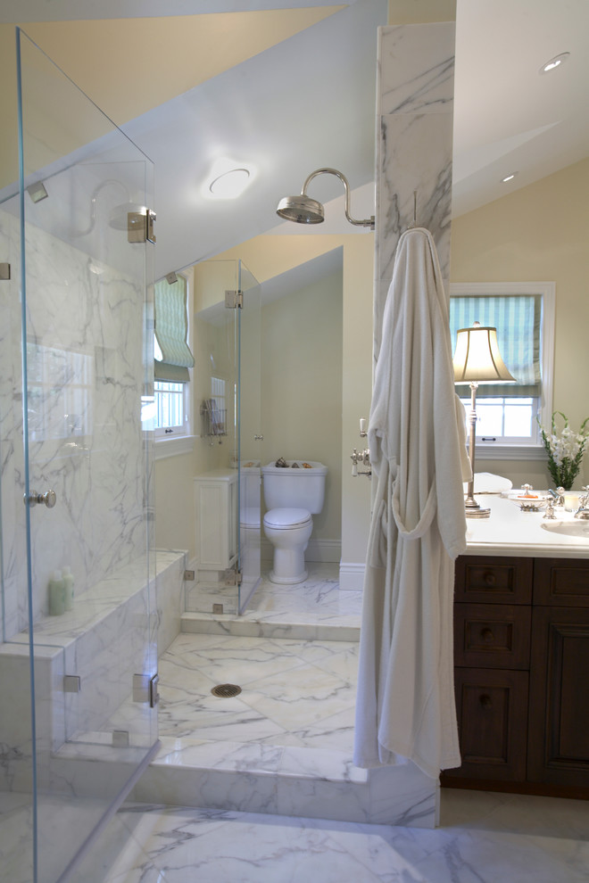 Alcove shower - mid-sized traditional master white tile and stone slab marble floor alcove shower idea in San Francisco with an undermount sink, flat-panel cabinets, dark wood cabinets, quartz countertops, a one-piece toilet and white walls