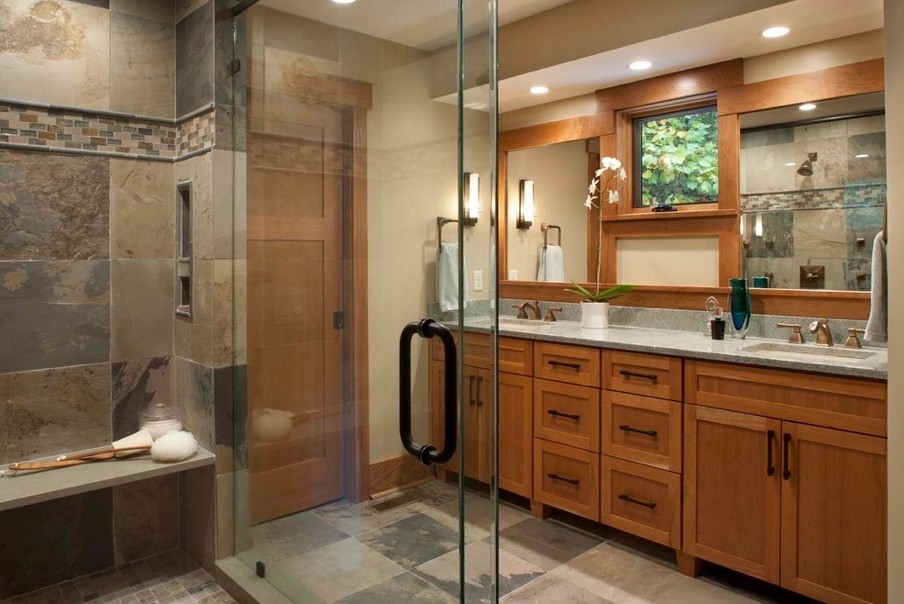 Photo of a medium sized contemporary ensuite bathroom in Houston with a submerged sink, shaker cabinets, light wood cabinets, granite worktops, a walk-in shower, grey tiles, stone tiles, beige walls, slate flooring and a hinged door.