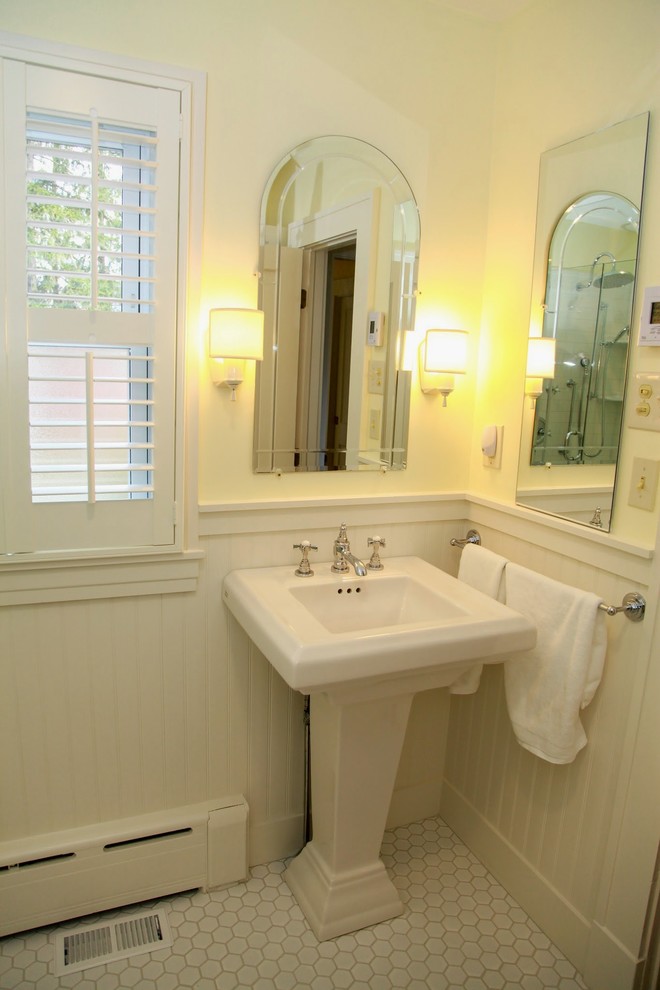 Corner shower - mid-sized traditional white tile and ceramic tile ceramic tile corner shower idea in DC Metro with a pedestal sink, a one-piece toilet and yellow walls