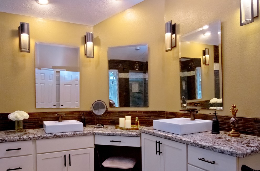 Bathroom - mid-sized transitional master brown tile and matchstick tile beige floor bathroom idea in Houston with shaker cabinets, white cabinets, yellow walls, a vessel sink, granite countertops, a hinged shower door and gray countertops