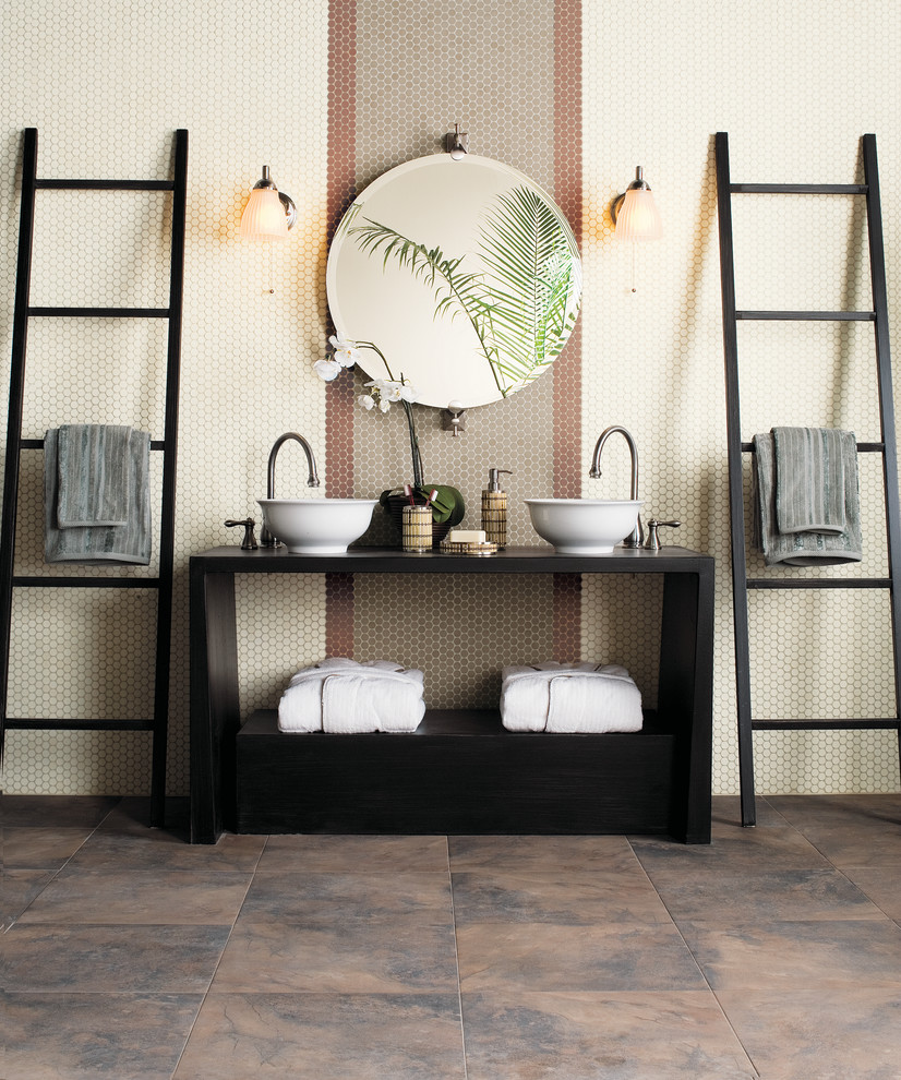 Inspiration for a world-inspired bathroom in Milwaukee with porcelain tiles, porcelain flooring, a vessel sink, wooden worktops, multi-coloured tiles, multi-coloured walls, open cabinets and black cabinets.