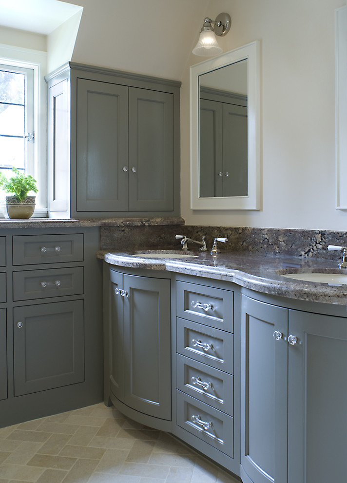 This is an example of a traditional bathroom in San Francisco with a submerged sink, shaker cabinets, grey cabinets and beige tiles.