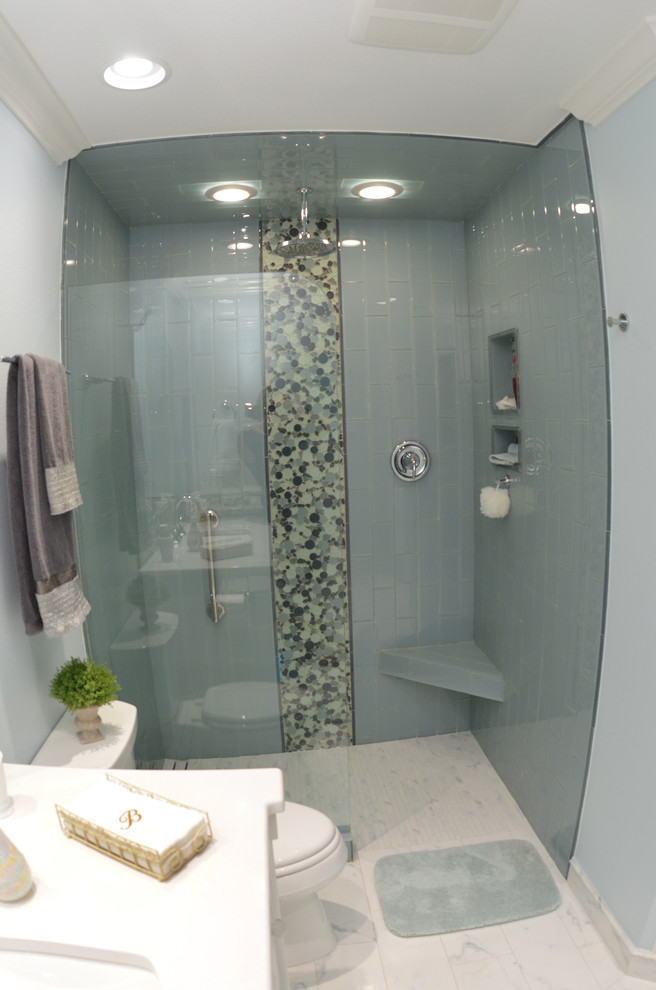 Design ideas for a medium sized classic shower room bathroom in Tampa with shaker cabinets, white cabinets, a corner shower, a one-piece toilet, blue walls, marble flooring, a submerged sink and solid surface worktops.