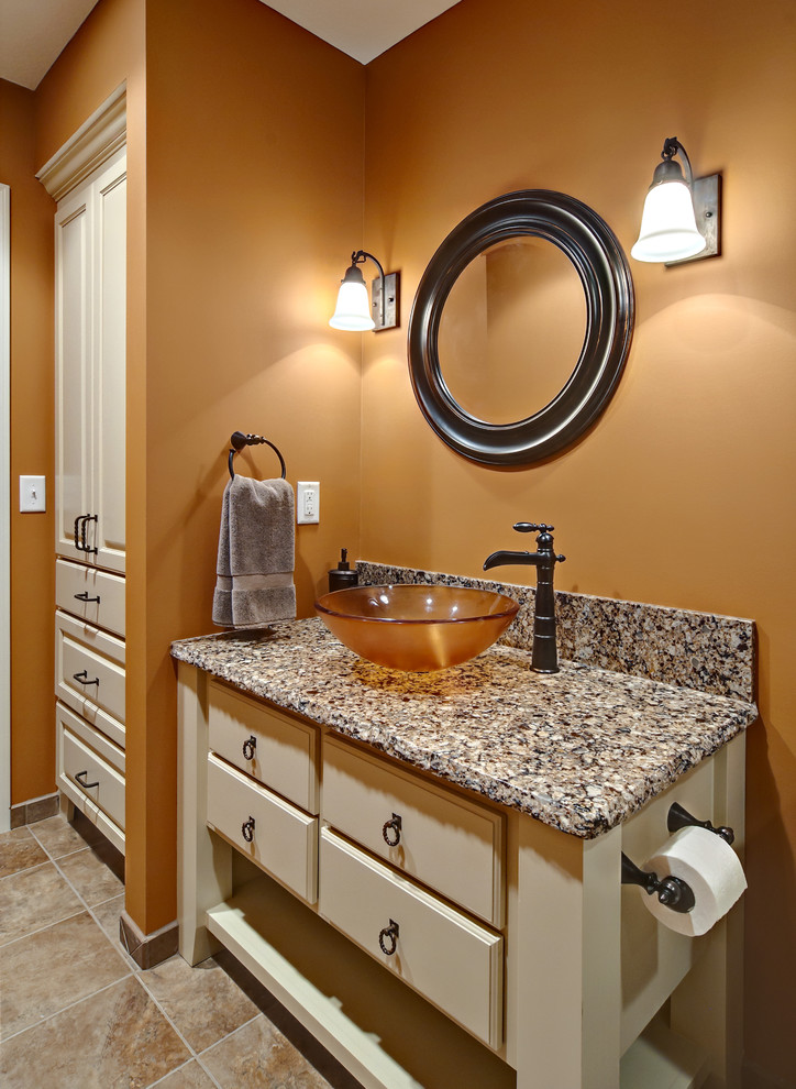 Design ideas for a traditional bathroom in Minneapolis with a vessel sink and feature lighting.