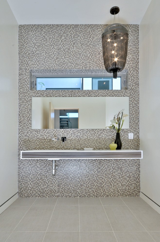 Large contemporary bathroom in Los Angeles with multi-coloured tiles, mosaic tiles and white walls.