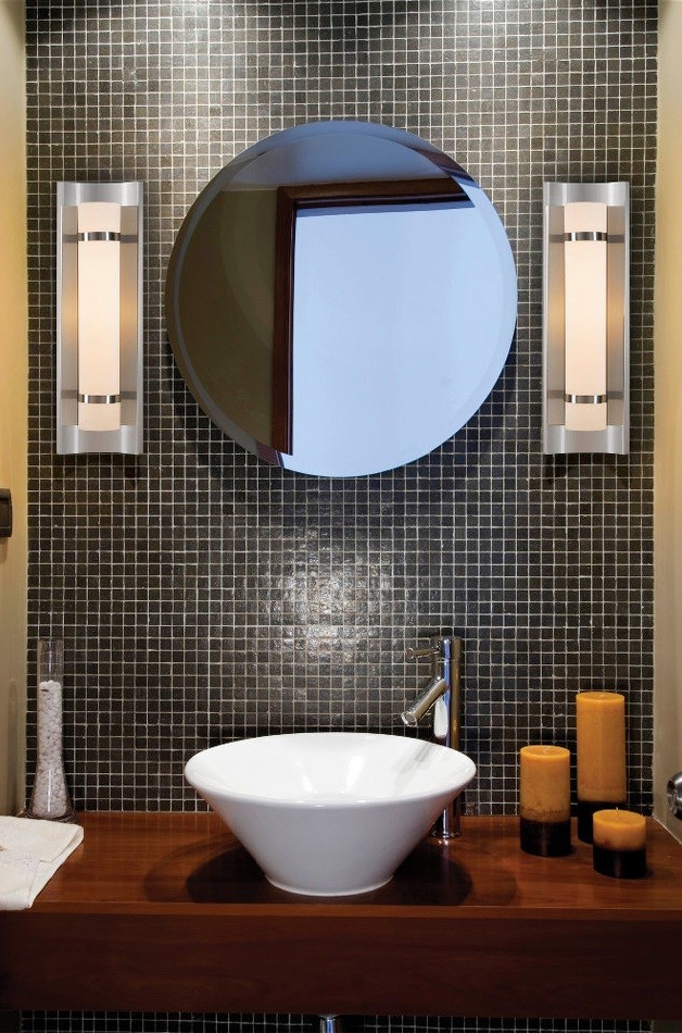 Example of a small trendy kids' black tile and ceramic tile bathroom design in New York with a vessel sink, medium tone wood cabinets, wood countertops, a one-piece toilet and black walls