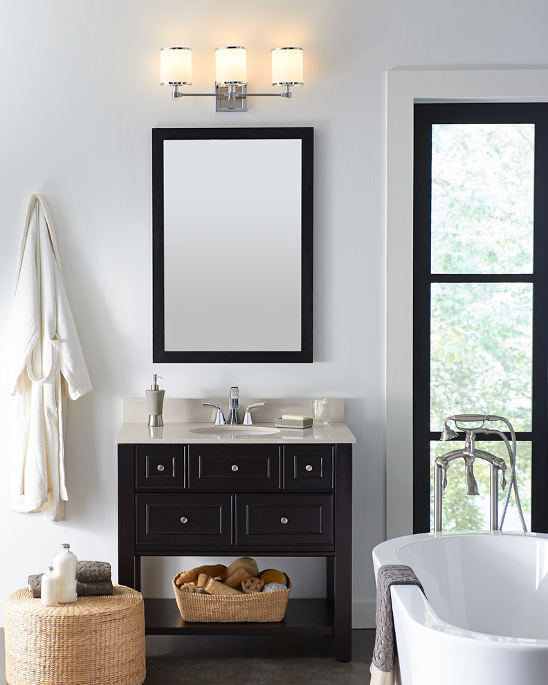 This is an example of a small classic shower room bathroom in Other with black cabinets, a freestanding bath, white walls, a built-in sink and laminate worktops.