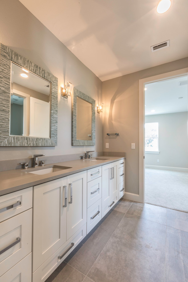 Medium sized rural family bathroom in Orlando with flat-panel cabinets, white cabinets, a corner bath, a shower/bath combination, a two-piece toilet, grey tiles, green walls, ceramic flooring, quartz worktops, grey floors and a shower curtain.