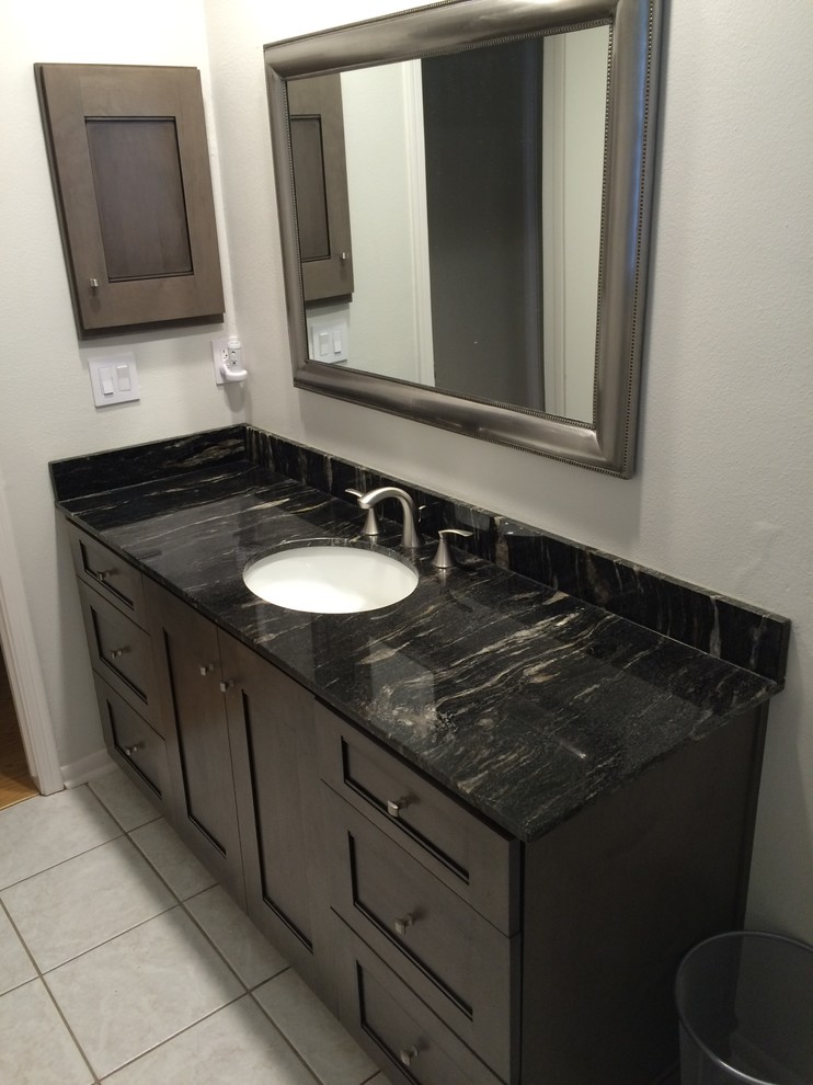 This is an example of a small modern shower room bathroom in Houston with a submerged sink, recessed-panel cabinets, dark wood cabinets, marble worktops and beige walls.
