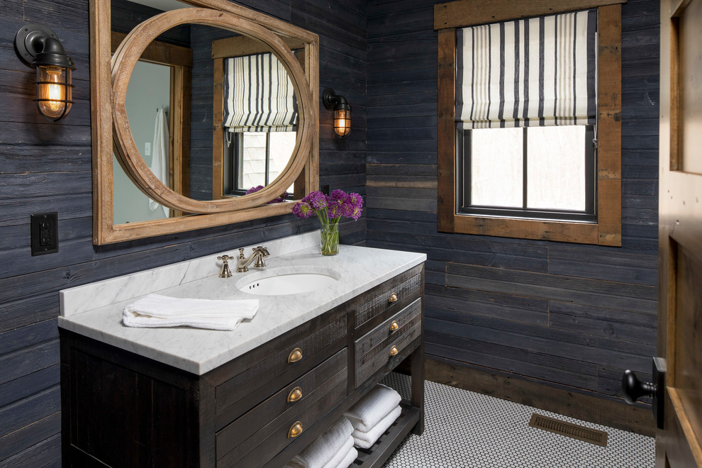 Inspiration for a mid-sized rustic ceramic tile and white floor alcove shower remodel in Minneapolis with flat-panel cabinets, dark wood cabinets, a one-piece toilet, blue walls, an undermount sink, marble countertops and a hinged shower door