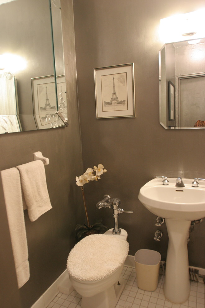Photo of a small classic shower room bathroom in New York with a one-piece toilet, brown walls, porcelain flooring, a pedestal sink and white floors.