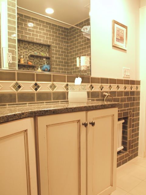 This is an example of a small traditional family bathroom in Newark with flat-panel cabinets, white cabinets, an alcove bath, a shower/bath combination, a one-piece toilet, green tiles, ceramic tiles, white walls, ceramic flooring, a submerged sink, granite worktops, white floors and a shower curtain.