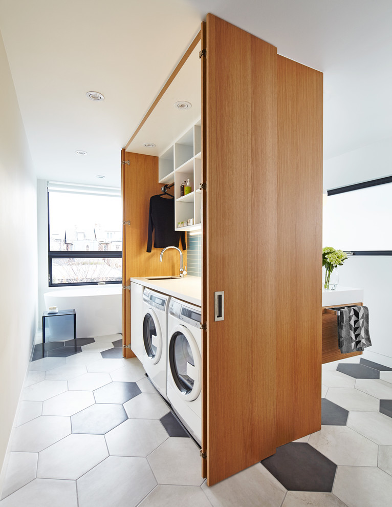 Mid-sized trendy porcelain tile and multicolored floor bathroom/laundry room photo in Toronto with open cabinets, white cabinets and white walls