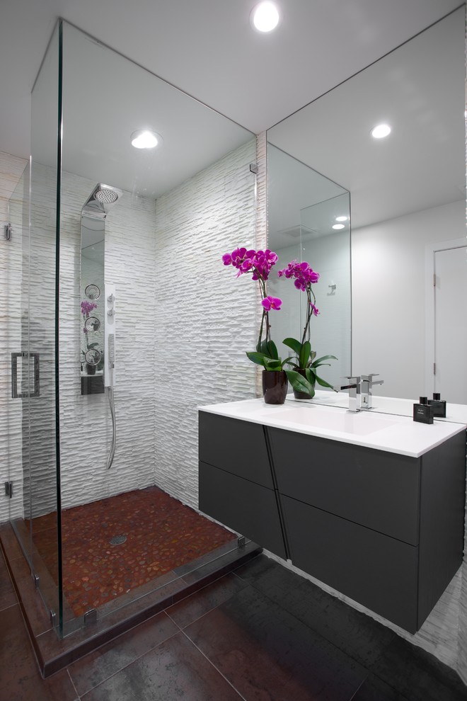 Design ideas for a contemporary bathroom in New York with an integrated sink and brown floors.