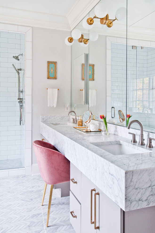 Inspiration for a mid-sized transitional master white tile and ceramic tile marble floor and white floor alcove shower remodel in Nashville with flat-panel cabinets, gray cabinets, a two-piece toilet, gray walls, an undermount sink, marble countertops, a hinged shower door and white countertops