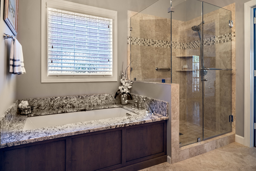 Mid-sized transitional master beige tile and porcelain tile porcelain tile corner shower photo in Nashville with an undermount sink, recessed-panel cabinets, gray cabinets, granite countertops, an undermount tub and gray walls