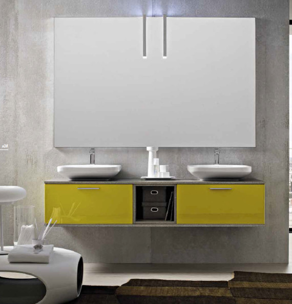 На фото: ванная комната среднего размера в стиле модернизм с фасадами с выступающей филенкой, желтыми фасадами, мраморной столешницей, серой плиткой, серыми стенами, бетонным полом и душевой кабиной с