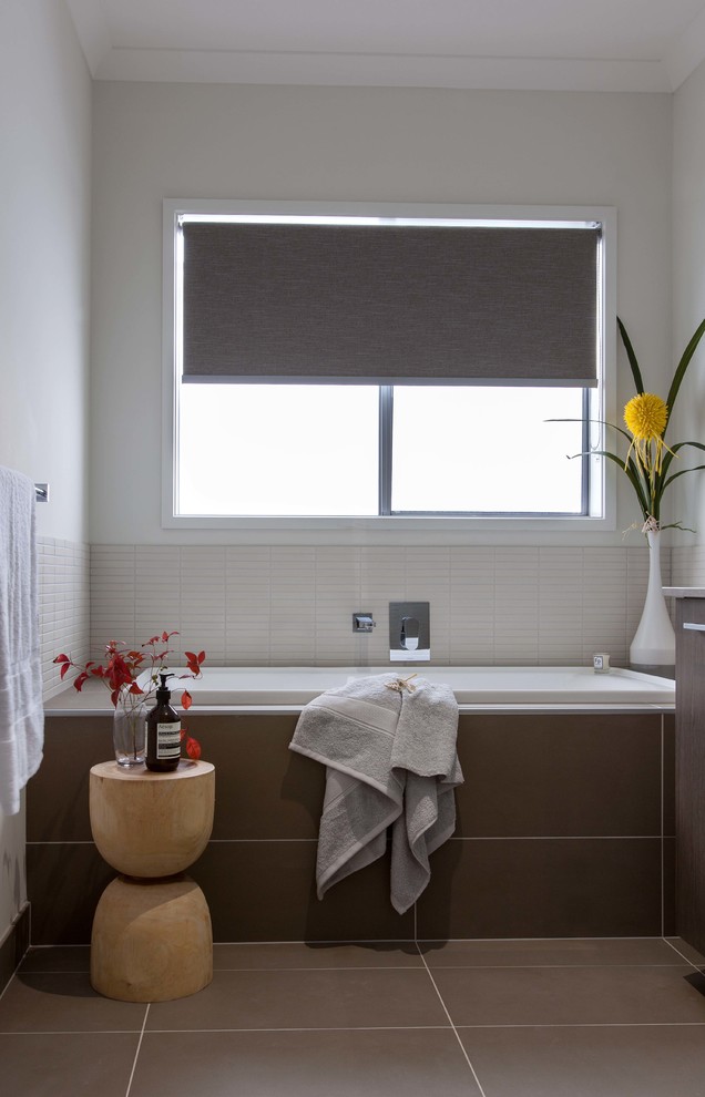 Bathroom - mid-sized contemporary kids' brown tile and ceramic tile ceramic tile bathroom idea in Melbourne with a drop-in sink, flat-panel cabinets, brown cabinets, a one-piece toilet and white walls