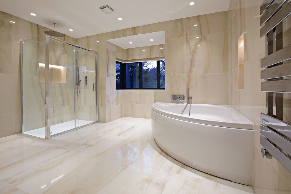Example of a large minimalist master beige tile and porcelain tile porcelain tile and beige floor bathroom design in London with flat-panel cabinets, a hot tub, a wall-mount toilet, beige walls, an integrated sink and white countertops