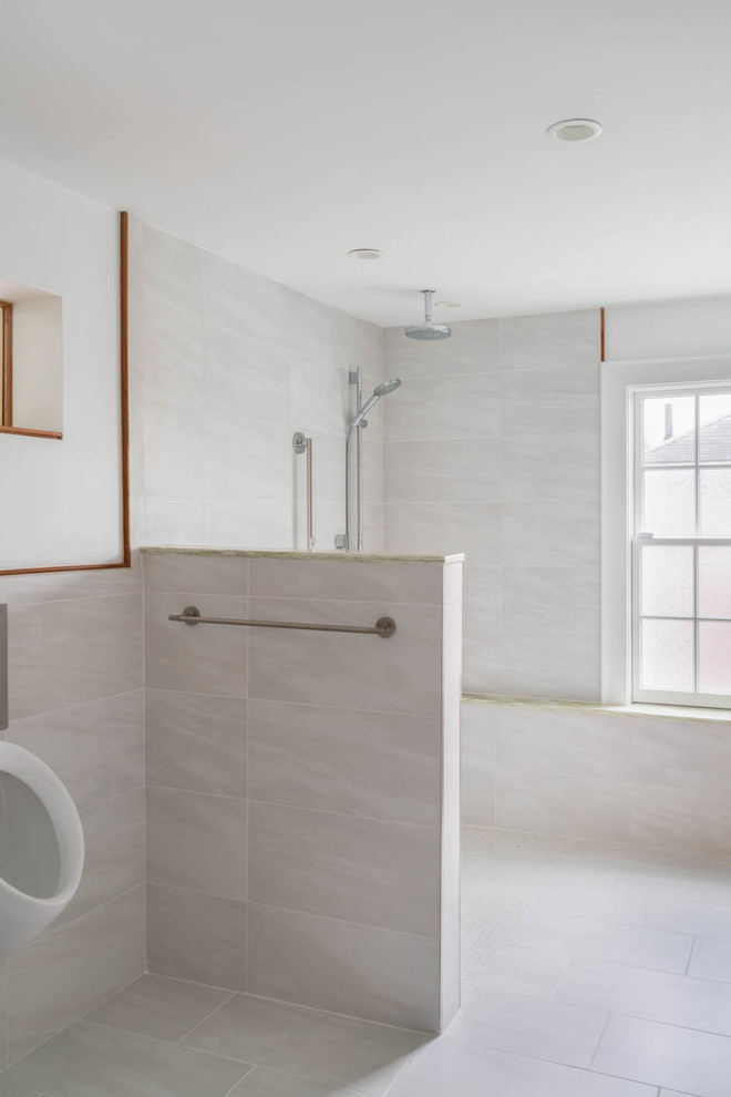 Photo of a medium sized contemporary shower room bathroom in Boston with a built-in shower, an urinal, white tiles, porcelain tiles, white walls, porcelain flooring, an integrated sink, solid surface worktops, white floors, an open shower and green worktops.