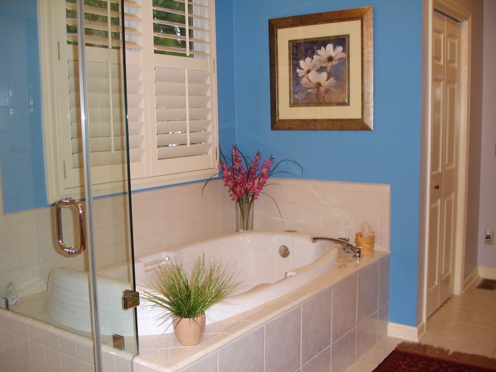 Example of a large master white tile and porcelain tile porcelain tile bathroom design in Charleston with a vessel sink, recessed-panel cabinets, medium tone wood cabinets, granite countertops and blue walls