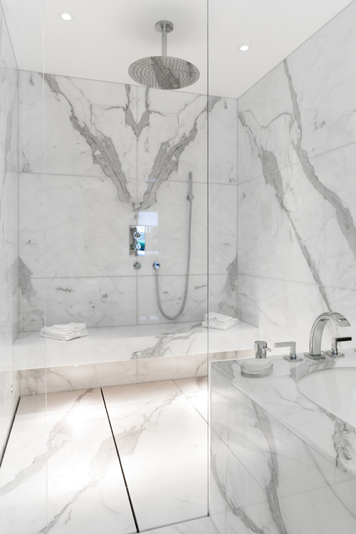 Modern Walk-in Shower Design with Bookmatched Marble Tiles