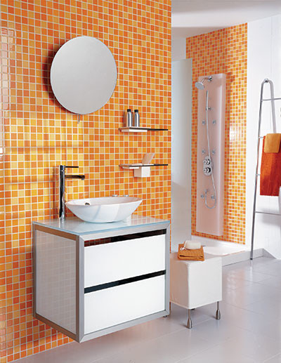 Inspiration for a medium sized contemporary shower room bathroom in New York with flat-panel cabinets, white cabinets, an alcove shower, orange tiles, mosaic tiles, white walls, ceramic flooring, a vessel sink, glass worktops, white floors, an open shower and blue worktops.