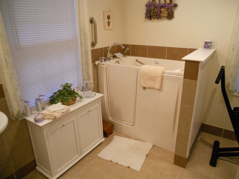 Design ideas for a medium sized ensuite bathroom in Cleveland with a japanese bath, a one-piece toilet, beige tiles, ceramic tiles, beige walls and ceramic flooring.