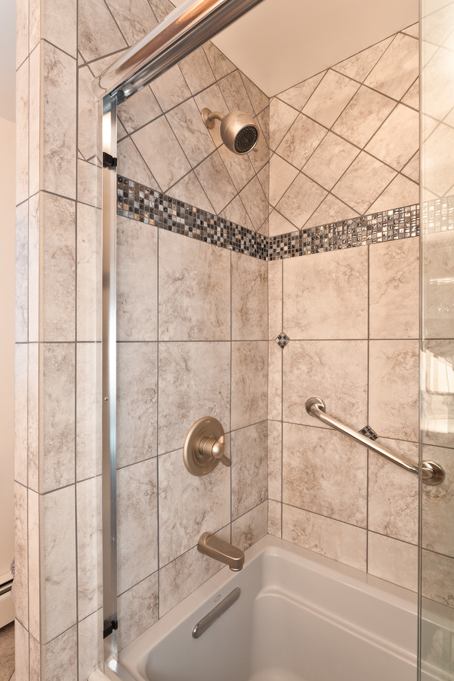Example of a mid-sized classic master beige tile, black and white tile, brown tile, gray tile and porcelain tile porcelain tile bathroom design in Other