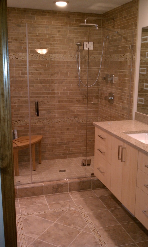 Inspiration for a mid-sized contemporary 3/4 beige tile corner shower remodel in Cleveland with light wood cabinets, an undermount sink, flat-panel cabinets, granite countertops and brown walls