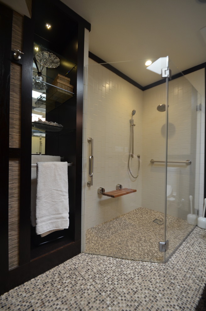 Example of a master walk-in shower design in San Francisco with shaker cabinets, black cabinets, beige walls and a vessel sink