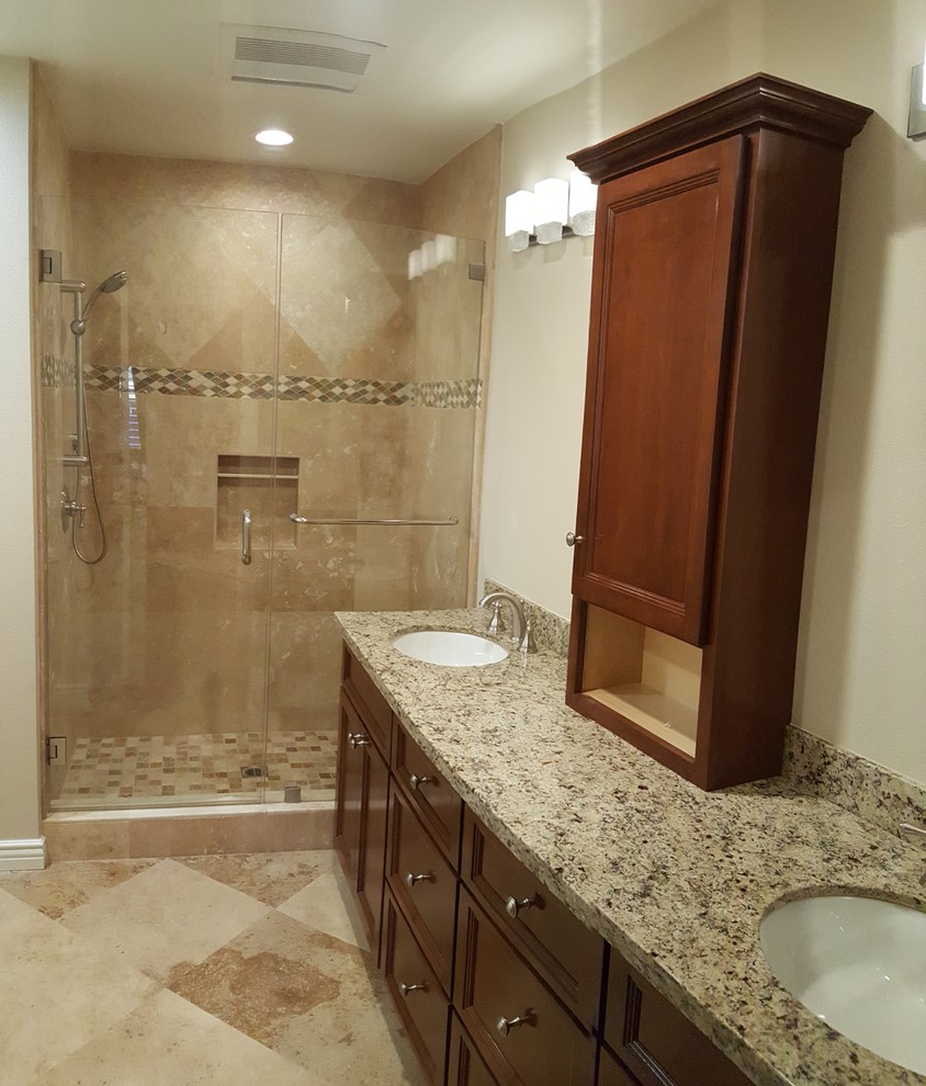 Photo of a medium sized traditional shower room bathroom in Los Angeles with beaded cabinets, medium wood cabinets, an alcove shower, beige tiles, porcelain tiles, beige walls, porcelain flooring, a submerged sink and granite worktops.