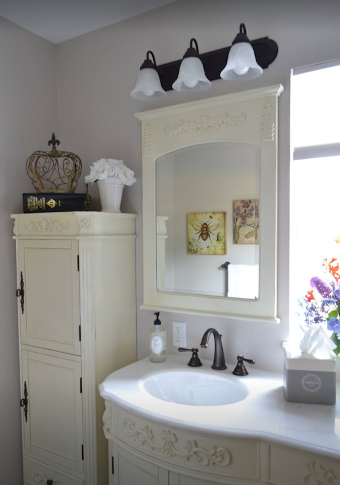 This is an example of a medium sized victorian ensuite bathroom in Seattle with beaded cabinets, white cabinets, grey walls, a submerged sink, engineered stone worktops and white worktops.