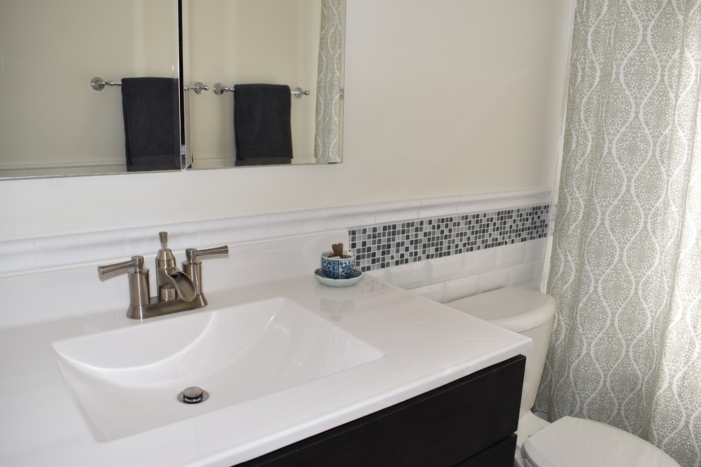 Photo of a small contemporary family bathroom in Other with white tiles, metro tiles, white walls and grey floors.