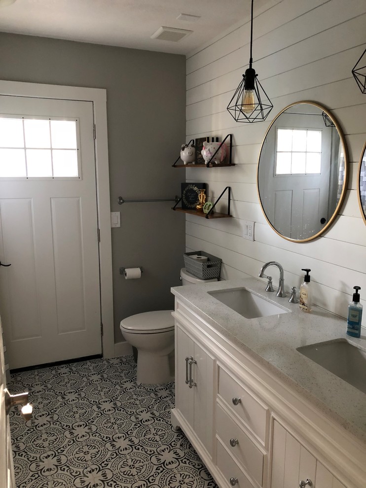 Bathroom - cottage black and white tile and ceramic tile ceramic tile and black floor bathroom idea in Phoenix with shaker cabinets, white cabinets, a one-piece toilet, white walls, a drop-in sink, quartzite countertops and white countertops