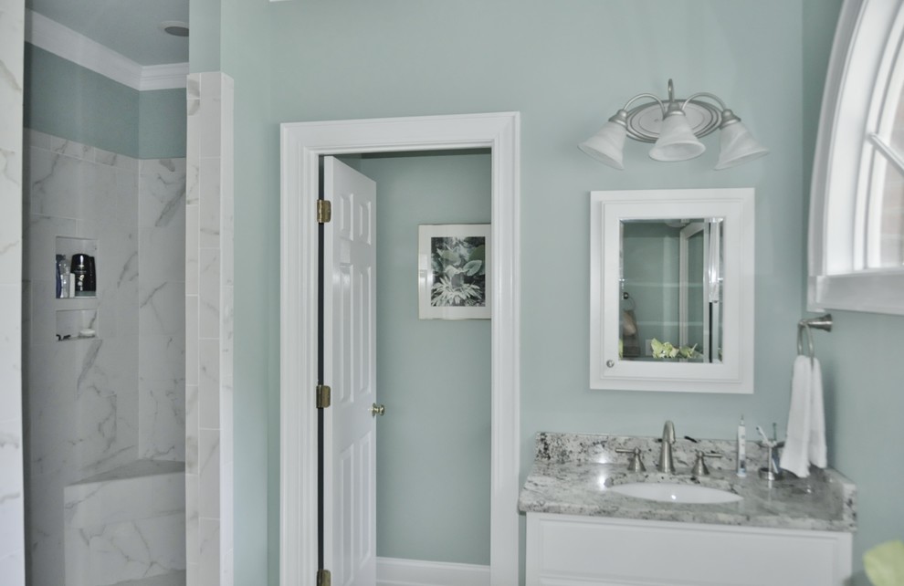 Bathroom - large transitional master white tile and porcelain tile porcelain tile and white floor bathroom idea in Other with raised-panel cabinets, white cabinets, granite countertops, a one-piece toilet, green walls and an undermount sink
