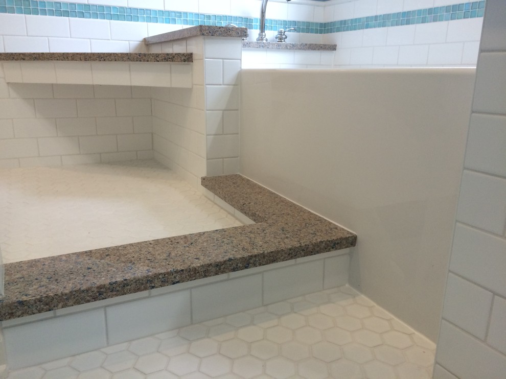 Mid-sized beach style master white tile and porcelain tile mosaic tile floor bathroom photo in Milwaukee with raised-panel cabinets, white cabinets, a one-piece toilet, blue walls, an undermount sink and granite countertops