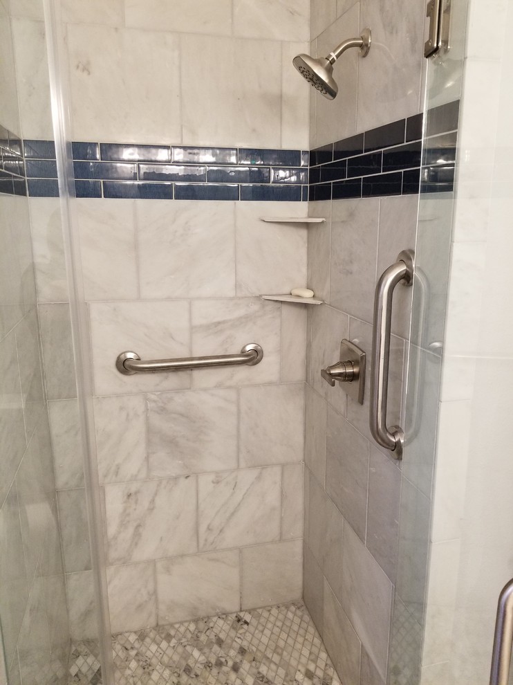 Alcove shower - mid-sized traditional master white tile and marble tile ceramic tile and beige floor alcove shower idea in Houston with white cabinets, a one-piece toilet, gray walls, an undermount sink, granite countertops and a hinged shower door