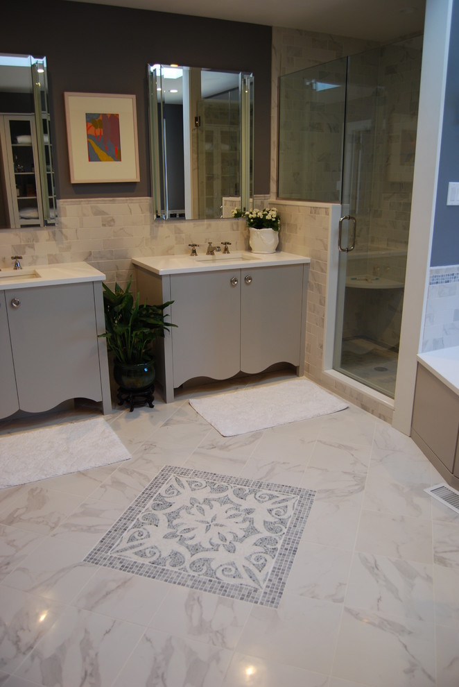 Inspiration for a medium sized classic ensuite bathroom in Philadelphia with flat-panel cabinets, grey cabinets, a submerged bath, a corner shower, a one-piece toilet, grey tiles, white tiles, marble tiles, grey walls, marble flooring, a submerged sink, quartz worktops, white floors and a hinged door.