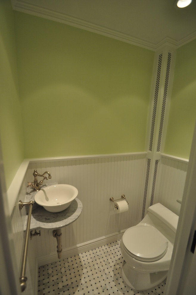 Example of a transitional powder room design in New York