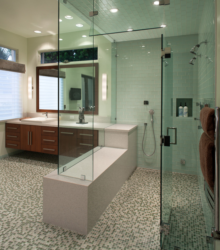 Large contemporary bathroom in San Diego with mosaic tiles, flat-panel cabinets, medium wood cabinets, multi-coloured tiles, mosaic tile flooring, a built-in sink and feature lighting.