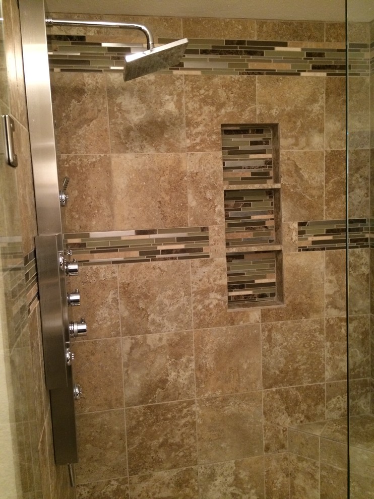 Photo of a large contemporary ensuite bathroom in Dallas with raised-panel cabinets, dark wood cabinets, a walk-in shower, beige tiles, porcelain tiles, grey walls, porcelain flooring, a submerged sink, granite worktops, grey floors, a hinged door and brown worktops.
